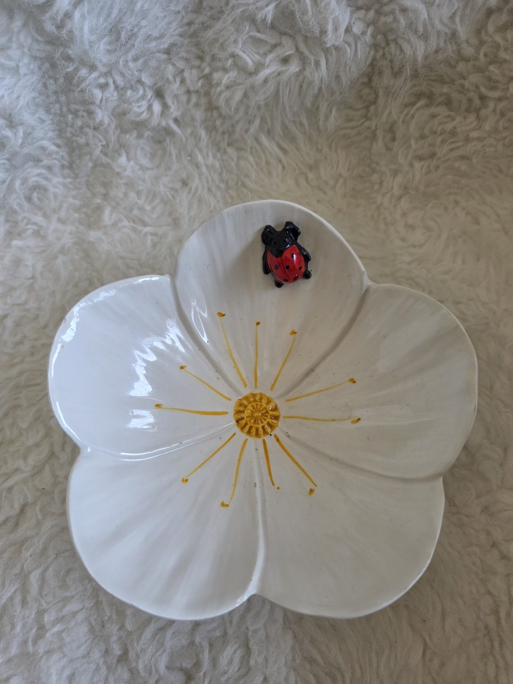 White Flower Ceramic Decorative Dish with Yellow Center and Red Ladybug Accent